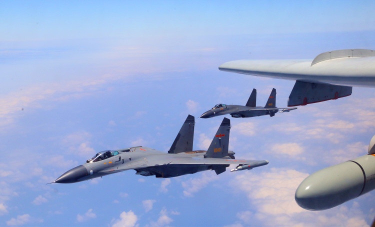 File Photo: A Chinese People's Liberation Army (PLA) air force formation conducts island patrols during training on April 26, 2018. The formation was made up of fighters, early warning and surveillance aircraft, and H-6K bombers, which took off from various military airfields. The formation flew over the Miyako Strait and Bashi Channel, completing an island patrol, the subject of the training. (Xinhua/Yuan Jun)