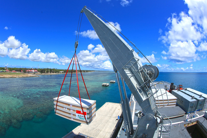 File photo taken on Feb. 19, 2022 shows relief supplies being unloaded from a ship of the Chinese People's Liberation Army (PLA) Navy at the port of Nuku' alofa, Tonga. (Photo by Xue Chengqing/Xinhua)