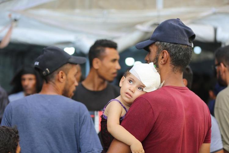 Wounded people are seen after Israeli attacks in the Nuseirat refugee camp in the central Gaza Strip on June 8, 2024. (Photo by Marwan Daoud /Xinhua)