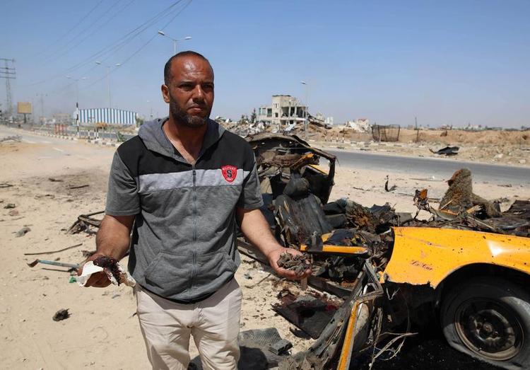 A man shows the debris after Israeli attacks in the Nuseirat refugee camp in the central Gaza Strip on June 8, 2024. (Photo by Marwan Daoud /Xinhua)