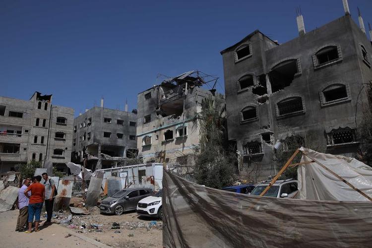 This photo taken on June 8, 2024 shows buildings and vehicles damaged during Israeli attacks in the Nuseirat refugee camp in the central Gaza Strip. (Photo by Marwan Daoud /Xinhua)