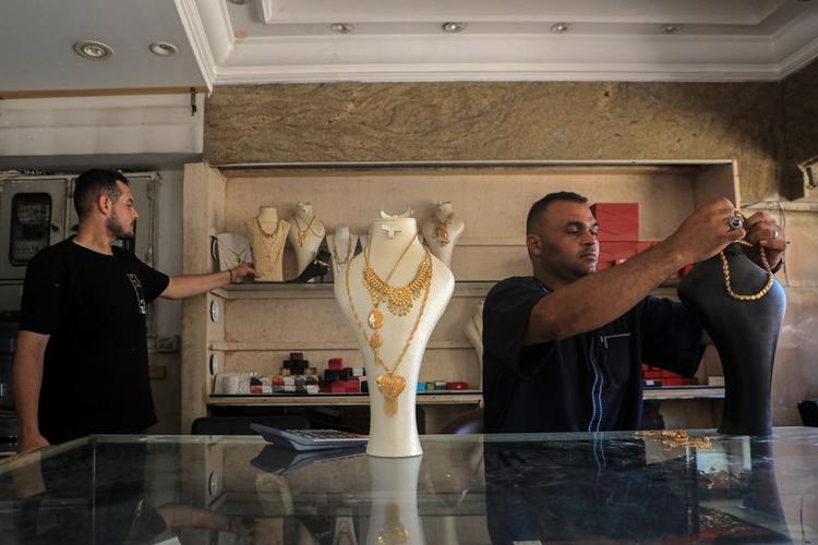 Merchants display gold crafts at a gold shop in Khan Younis, southern Gaza, on June 26, 2024. (Photo by Rizek Abdeljawad/Xinhua)