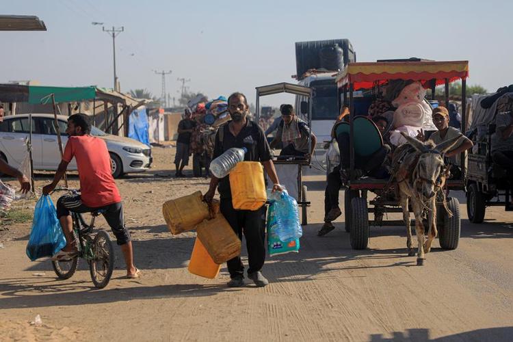 Displaced Palestinians flee from the Al-Mawasi area on the northwestern outskirts of Rafah in the southern Gaza Strip, on June 28, 2024. (Photo by Rizek Abdeljawad/Xinhua)