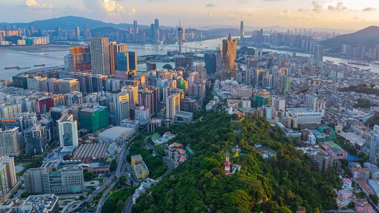 An aerial drone photo shows the Macao Peninsula (front) on July 8, 2024. (Xinhua/Cheong Kam Ka)