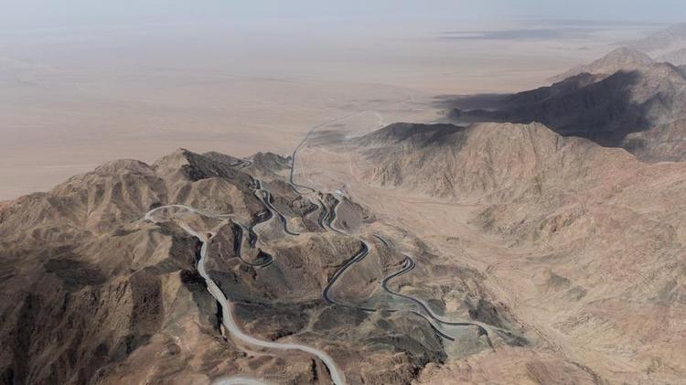 This aerial photo taken on April 8, 2023 shows a winding mountain road leading to the Lenghu observatory site in northwest China's Qinghai Province. (Xinhua/Chen Jie)