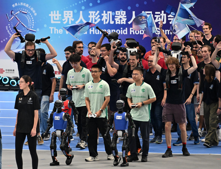 The international squad march in the stadium during the opening ceremony of the 2025 World Humanoid Robot Games in Beijing, capital of China, Aug. 14, 2025. (Xinhua/Zhang Chenlin)