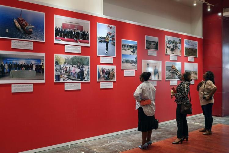 Guests visit a photo exhibition marking the 50th anniversary of diplomatic relations between China and Mozambique in Maputo, Mozambique, Sept. 12, 2025. (Xinhua/Han Xu)