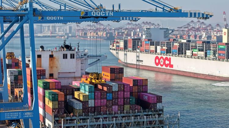 A drone photo taken on Dec. 4, 2025 shows cargo ships loading and unloading containers at the Qianwan Container Terminal of Qingdao Port in east China's Shandong Province. (Xinhua/Li Ziheng)