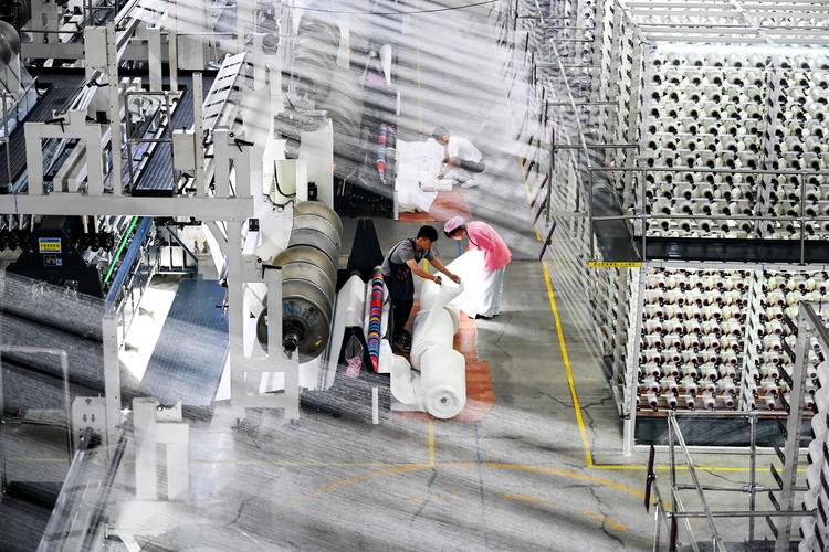 This photo taken on Aug. 20, 2025 shows a smart workshop of SinceTech, a shoe material textile company, in Jinjiang, southeast China's Fujian Province. (Xinhua/Lin Shanchuan)