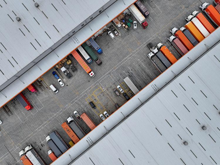 Photo taken on Nov. 11, 2025 shows trucks unloading goods at a logistics park in Longli County, southwest China's Guizhou Province. (Photo by Yuan Fuhong/Xinhua)