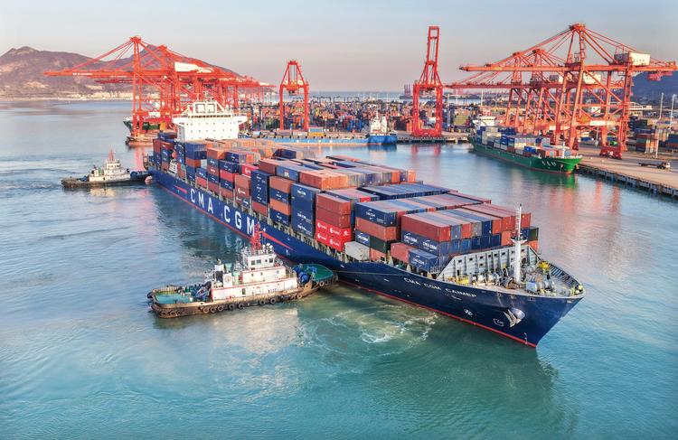 An aerial drone photo taken on Dec. 5, 2025 shows a cargo ship docking at Lianyungang Port, east China's Jiangsu Province.(Photo by Wang Jianmin/Xinhua)