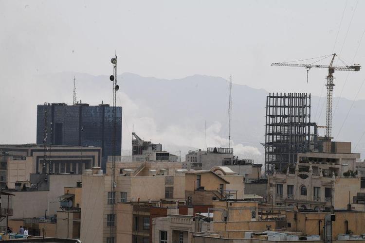 This photo taken on Feb. 28, 2026 shows thick smoke rising in downtown Tehran, Iran. (Xinhua/Shadati)
