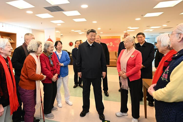 Chinese President Xi Jinping, also general secretary of the Communist Party of China Central Committee and chairman of the Central Military Commission, talks with elderly residents while visiting an apartment complex for seniors in Xicheng District of Beijing, capital of China, Feb. 10, 2026. (Xinhua/Yan Yan)