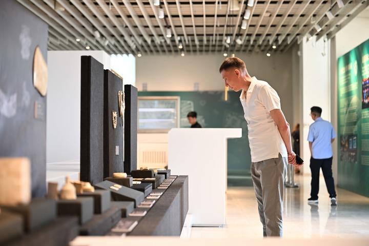 People visit a digital archaeological exhibition showcasing the ancient Chinese Liangzhu culture during the 2026 Shanghai Cooperation Organization (SCO) Dialogue of Civilizations in Bishkek, the capital of Kyrgyzstan, July 14, 2026. (Xinhua/Li Renzi)