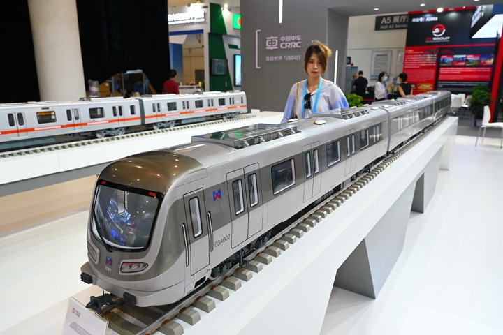 A visitor views a model of Xiamen Metro train at the exhibition of BRICS New Industrial Revolution 2024 in Xiamen, southeast China's Fujian Province, Sept. 10, 2024.