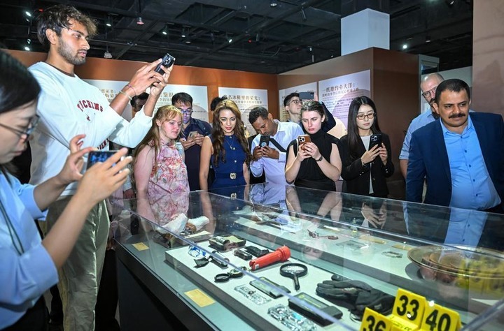 Foreign students attending Sharing Session: Tales of People-to-People Bonds Between China and the U.S. & Re-China Dialogue visit an exhibition highlighting friendly exchanges between the civilian sectors of China and the United States at the Overseas Chinese History Museum of China in Beijing, capital of China, June 30, 2026. (Xinhua/Jin Liangkuai)