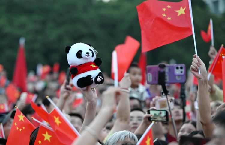 People attend a flag-raising ceremony marking the 77th anniversary of the founding of the People's Republic of China at Wuyi Square in Fuzhou, southeast China's Fujian Province, Oct. 1, 2026. People celebrated the 77th anniversary of the founding of the People's Republic of China in various ways on Thursday. (Xinhua/Lin Shanchuan)