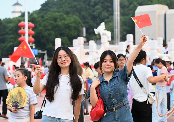 People attend a flag-raising ceremony marking the 77th anniversary of the founding of the People's Republic of China at Wuyi Square in Fuzhou, southeast China's Fujian Province, Oct. 1, 2026. People celebrated the 77th anniversary of the founding of the People's Republic of China in various ways on Thursday. (Xinhua/Lin Shanchuan) People attend a flag-raising ceremony marking the 77th anniversary of the founding of the People's Republic of China at Wuyi Square in Fuzhou, southeast China's Fujian Province, Oct. 1, 2026. People celebrated the 77th anniversary of the founding of the People's Republic of China in various ways on Thursday. (Xinhua/Lin Shanchuan)