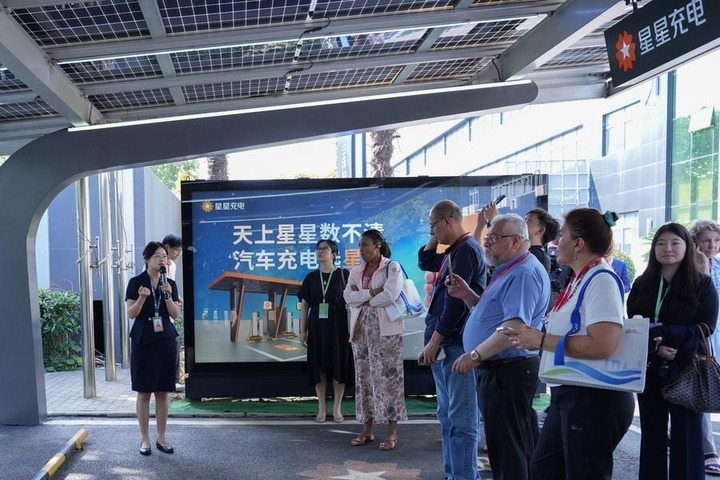 Journalists visit Star Charge, a charging infrastructure operator, in Changzhou, east China's Jiangsu Province, Oct. 14, 2026. (Photo by Zhao Yanchao/Xinhua)