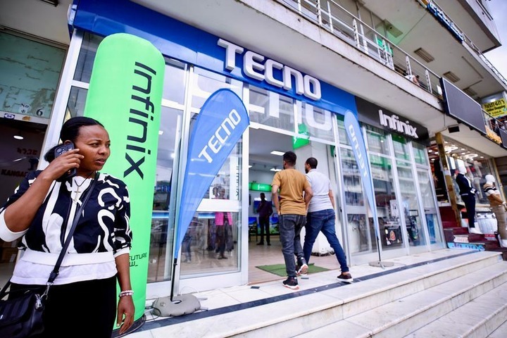 People walk past a Tecno store in Nairobi, Kenya, Oct. 13, 2026. (Xinhua/Geng Xinning)