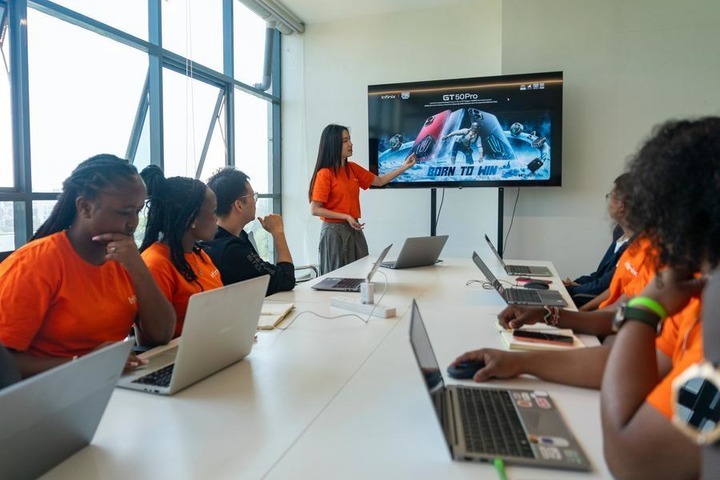 Staff members discuss the marketing strategy at the Tecno office in Nairobi, Kenya, Aug. 25, 2026. (Xinhua/Xie Jianfei)
