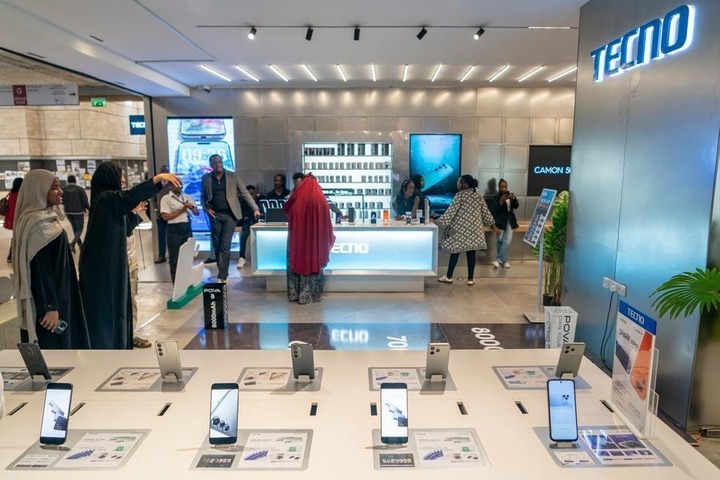 Customers try smartphones at a Tecno store in Nairobi, Kenya, Aug. 25, 2026. (Xinhua/Xie Jianfei)